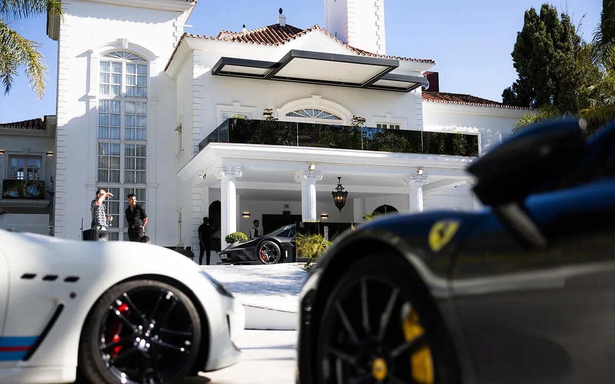 TFAG Art House El Martinete, white villa entrance with supercars in the forecourt